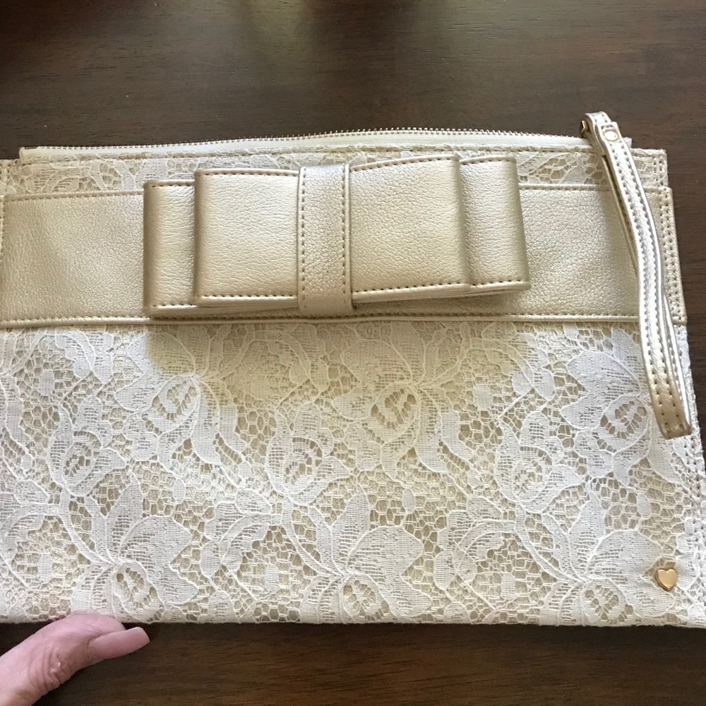 Beautiful NWOT Gold leather and lace clutch.